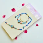 Blue Lotus Charm Bhaiya-Bhabhi Rakhi Set – RK-269 | Elegant Beads & Pearl Detailing - Image 2