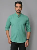 Bright green men's kurta with mandarin collar, long sleeves, and button-down front, perfect for traditional or casual wear, styled with black pants and wristwatch.